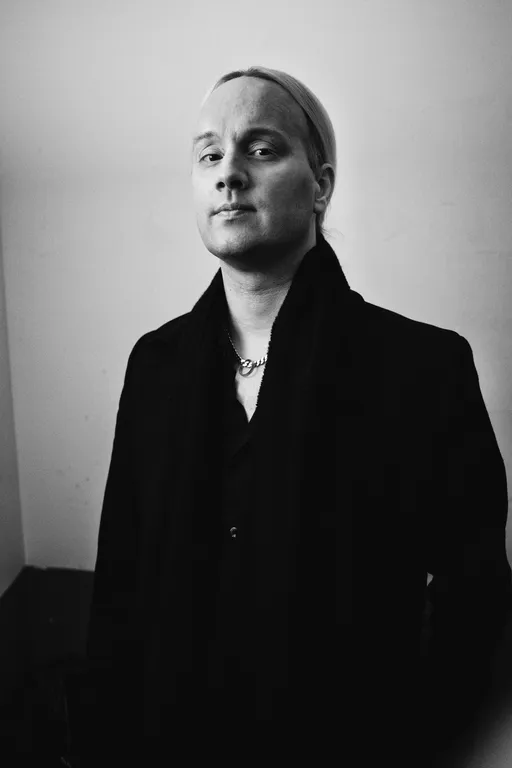 Black and white portrait of Olof Mörck of Amaranthe.