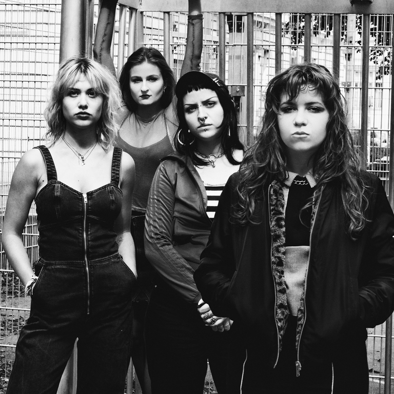 Black and white group photograph of the band Mommy is Mental.