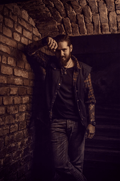 The Process: Boundary – Overdose of Sin. Animated music video. - A man standing in front of a brick wall - Portrait -m-